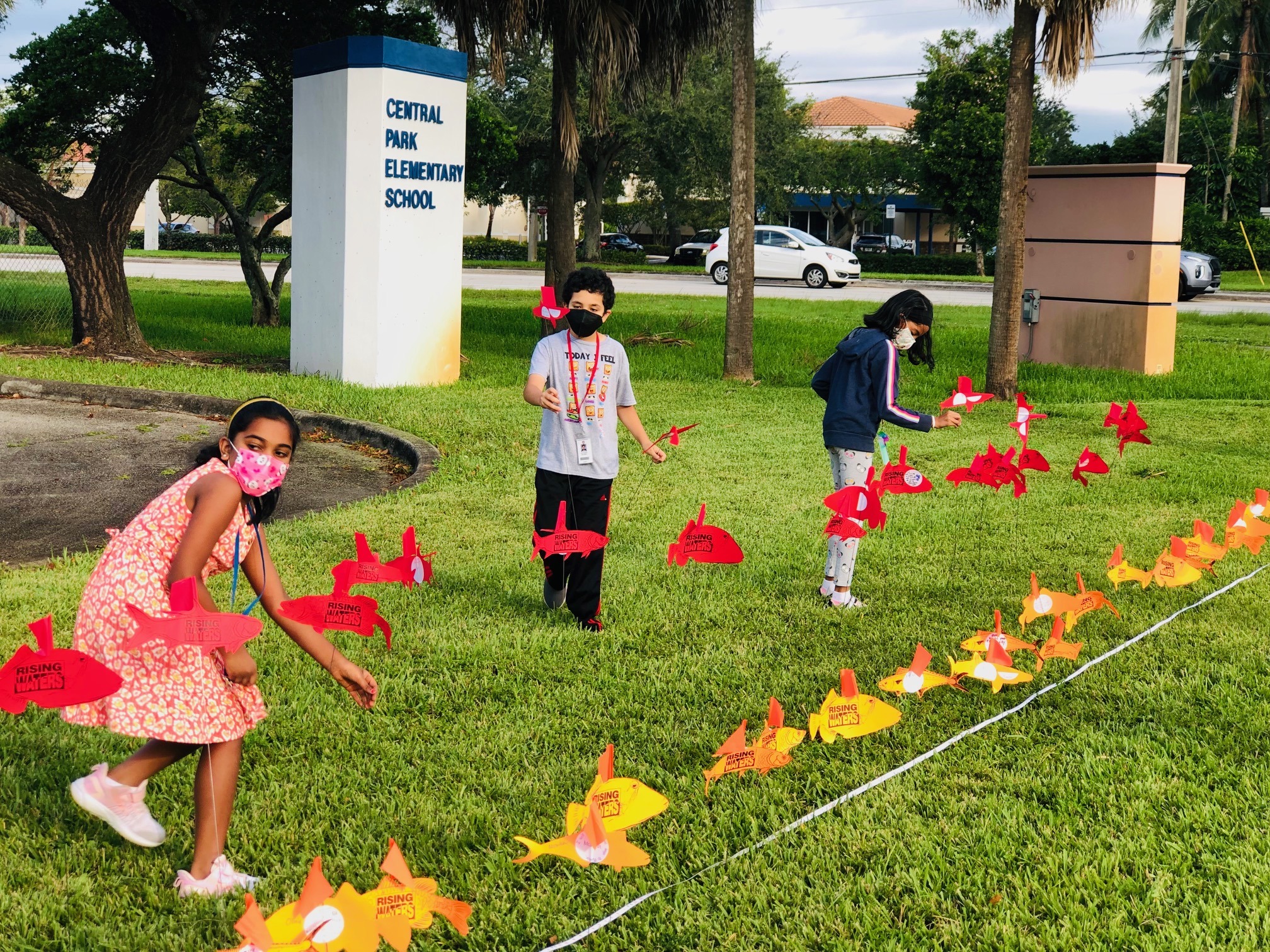 Students installing their action fish